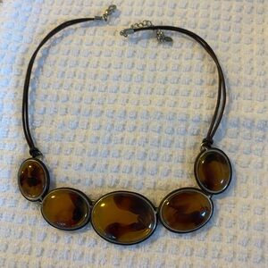 Tortoiseshell stone necklace.